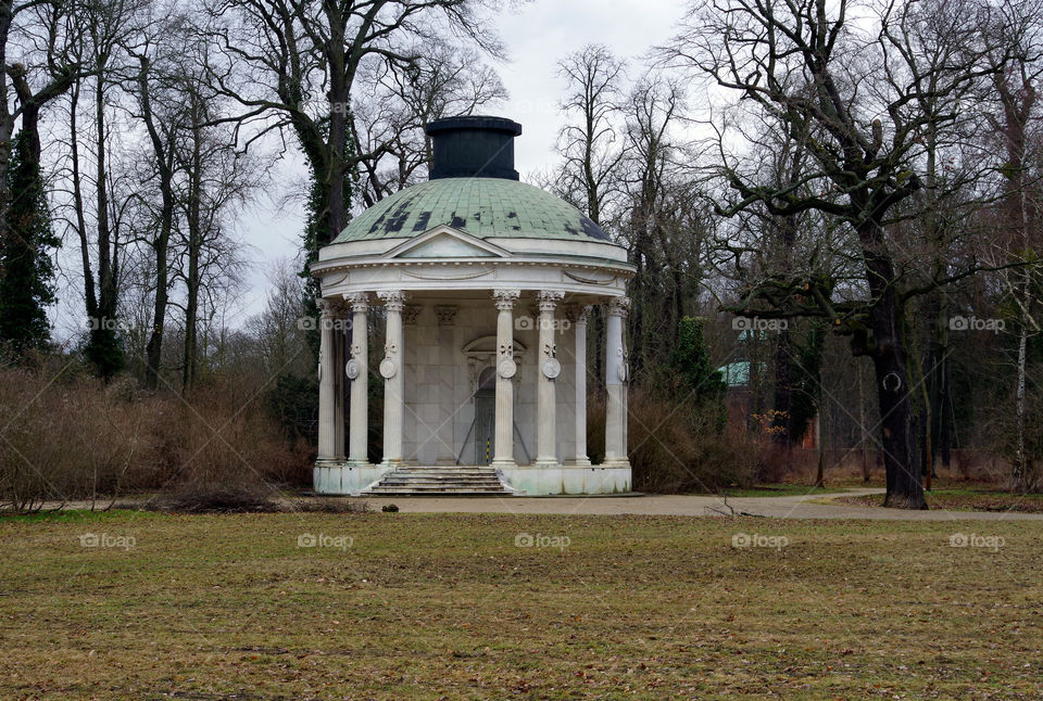 View of marble gazebo in park.