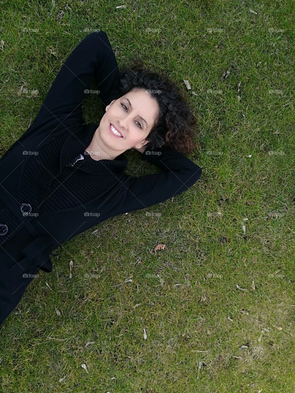 woman lying on the grass