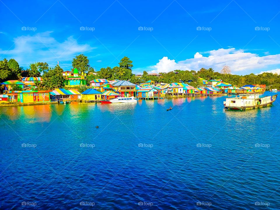 Beautiful view of the Rainbow Village in Tual City with itu blue bay