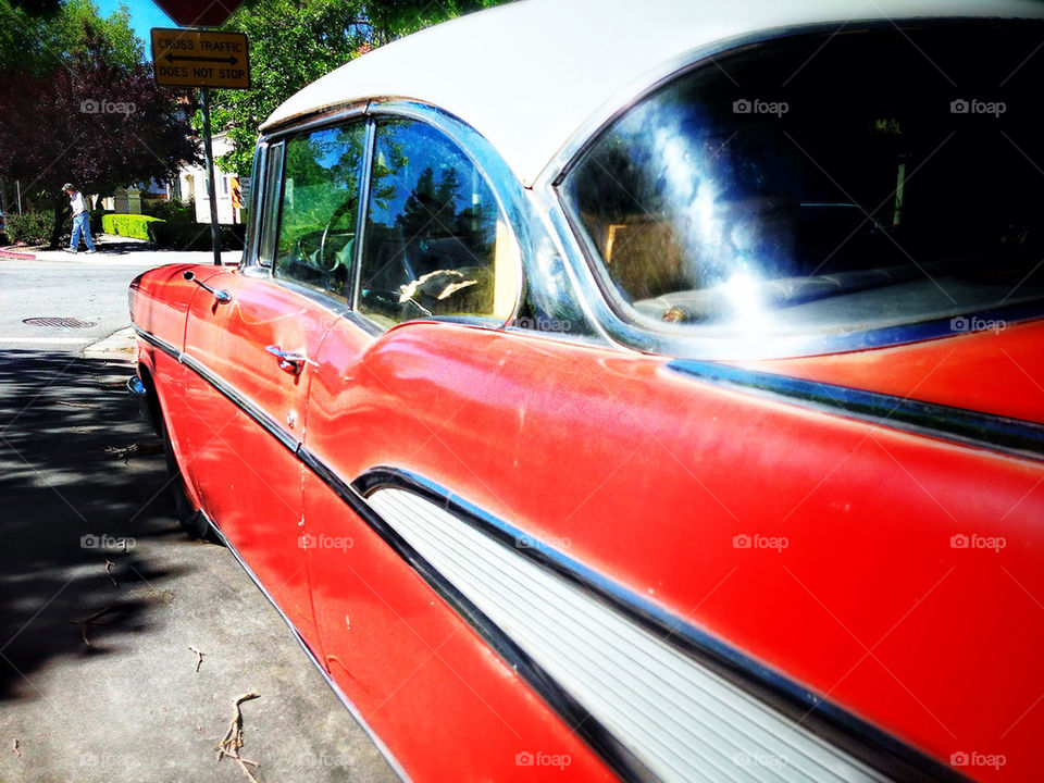 Shiny red 1957 Chevrolet sedan