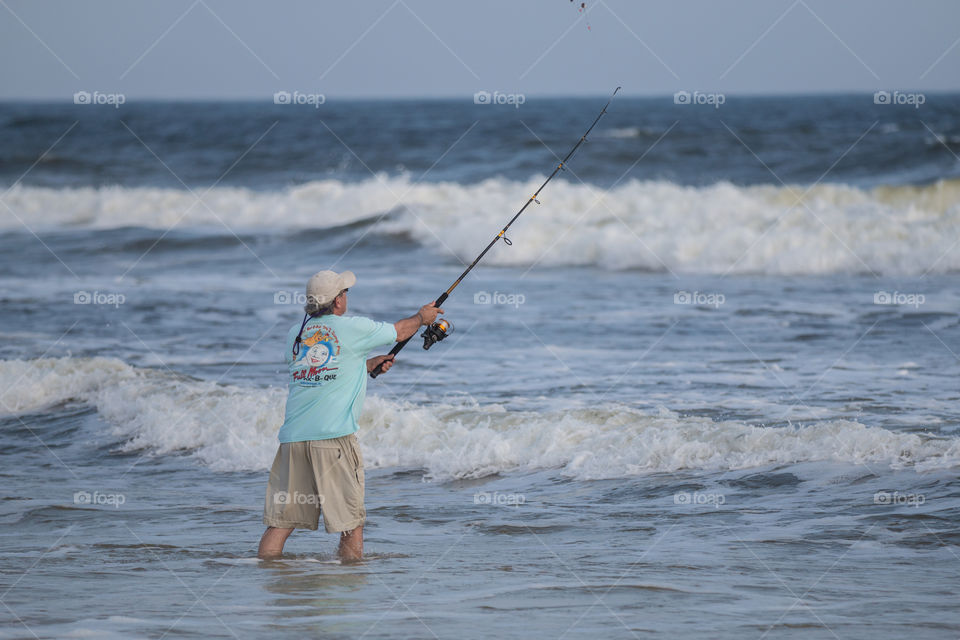 Man fishing in the beach