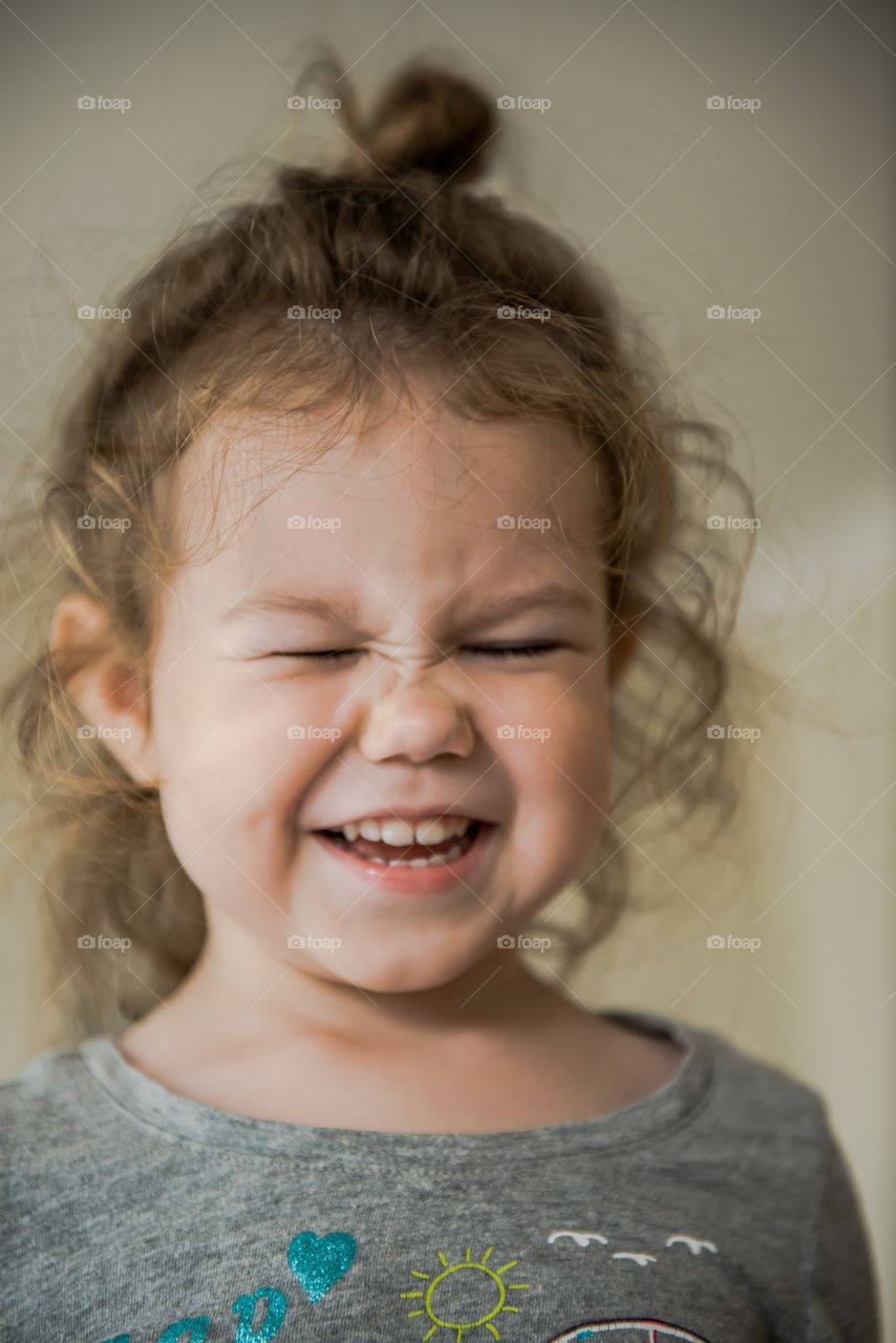 Child girl making funny faces