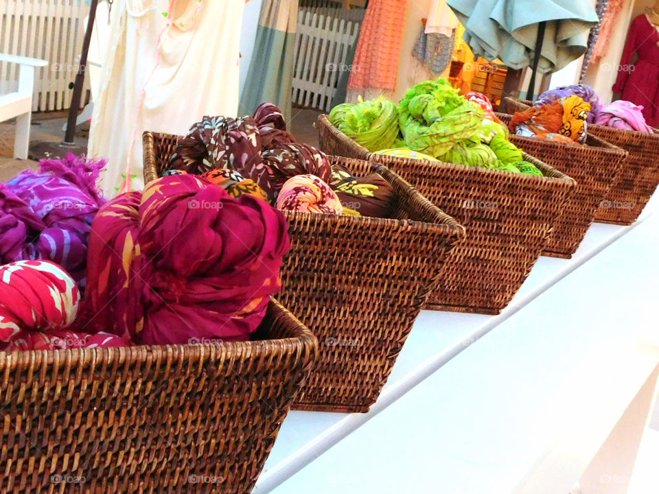 Colorful scarfs in baskets