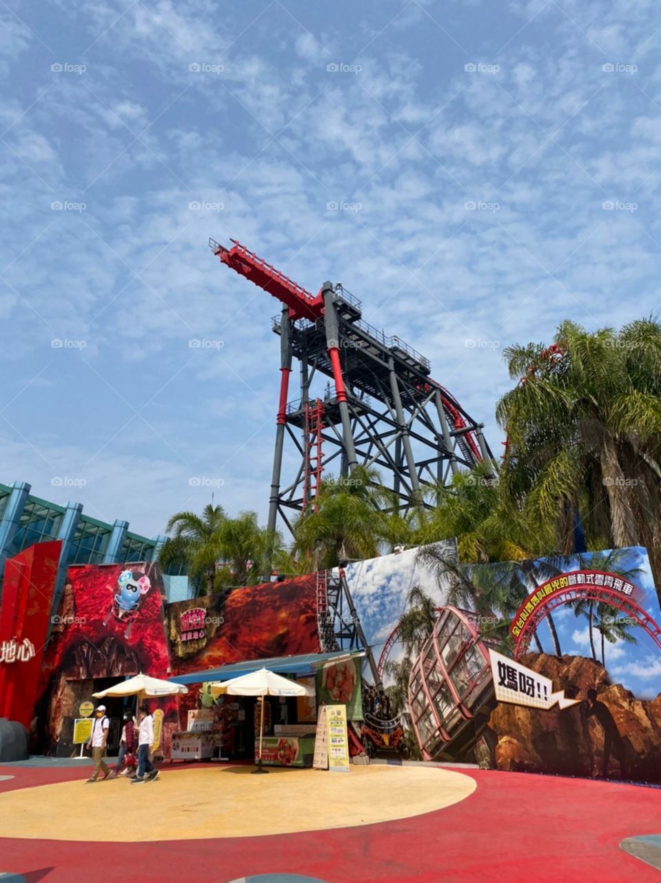 Red roller coaster in the amusement park.