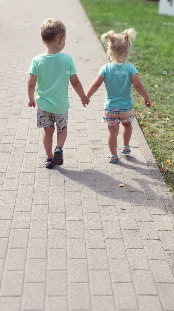 brother and sister walk