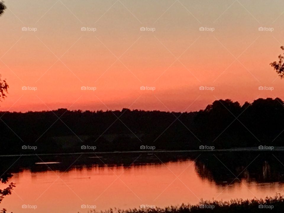Red sunset over lake