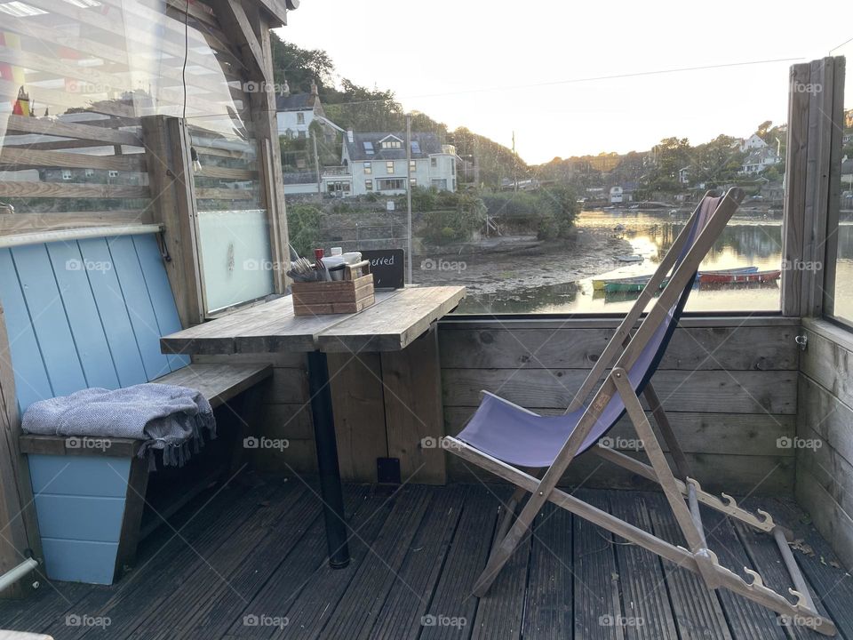 Outdoor pub seating with a stunning creekside view 