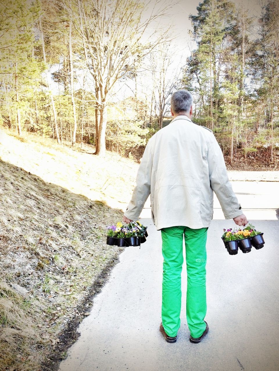 spring flower man in green trousers