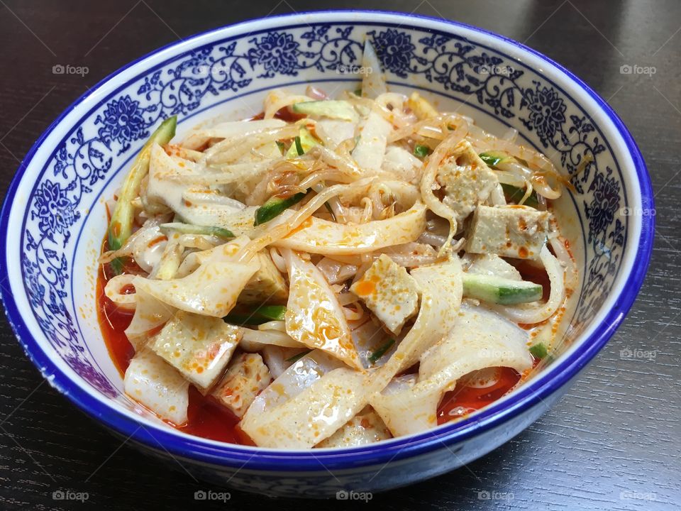 Shanxi spicy cold noodles in Chinese porcelain bowl