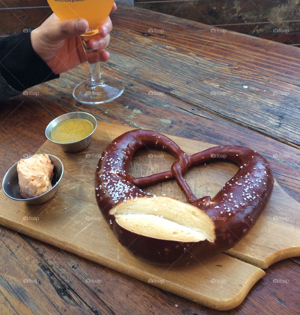 Pretzel, dipping sauces, and beer.