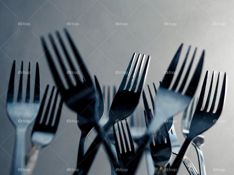 Close-up of dancing forks