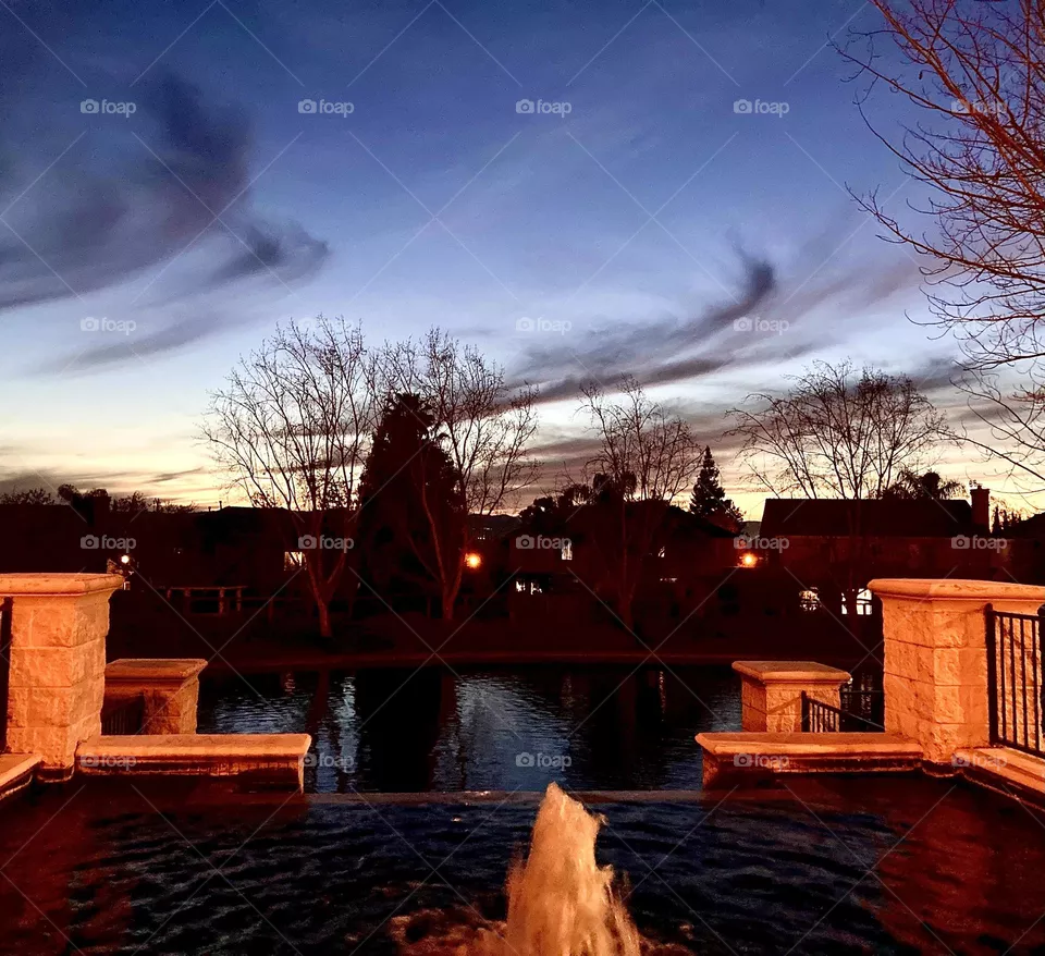 Evening sky at the pond fountain 