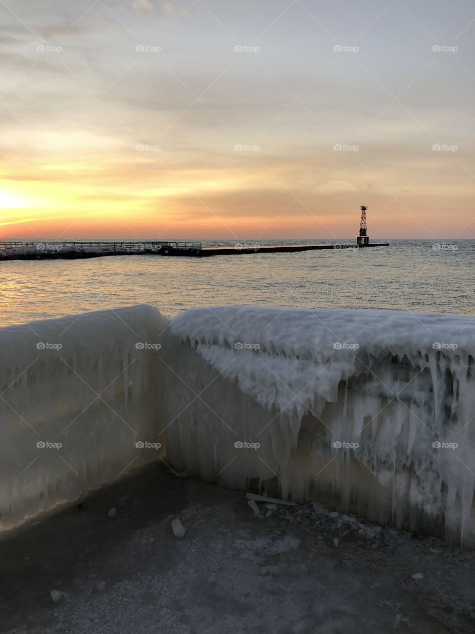 Sunset, frozen bridge, Lake Michigan