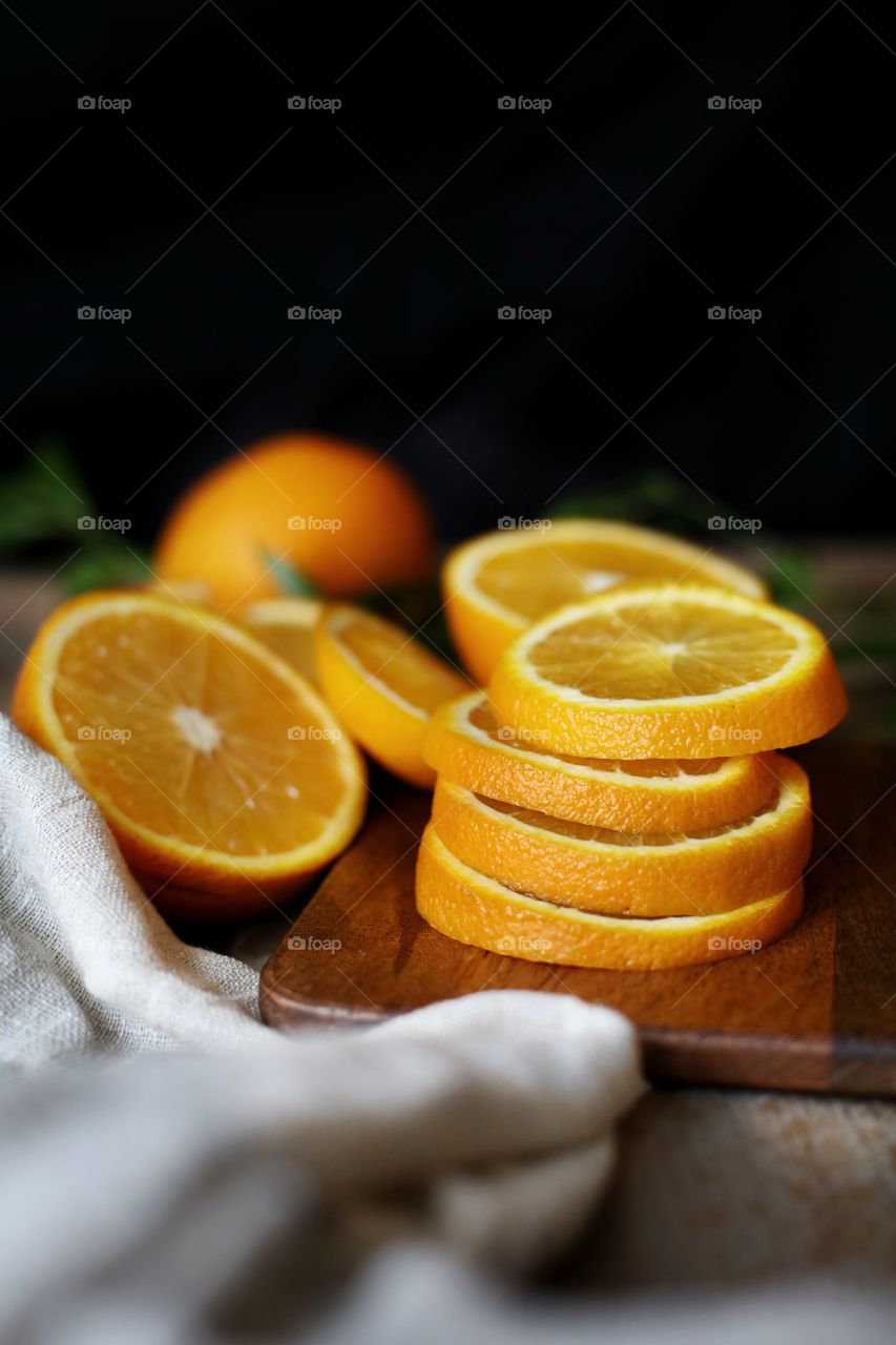 sliced oranges on the cutlery board