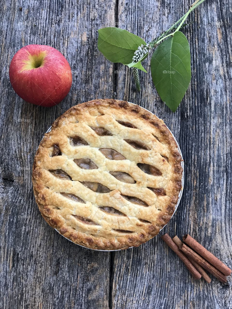 Fresh baked apple pie cooling on a wooden table!