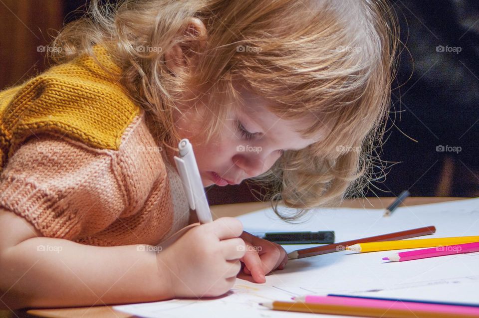 girl draws a beautiful picture