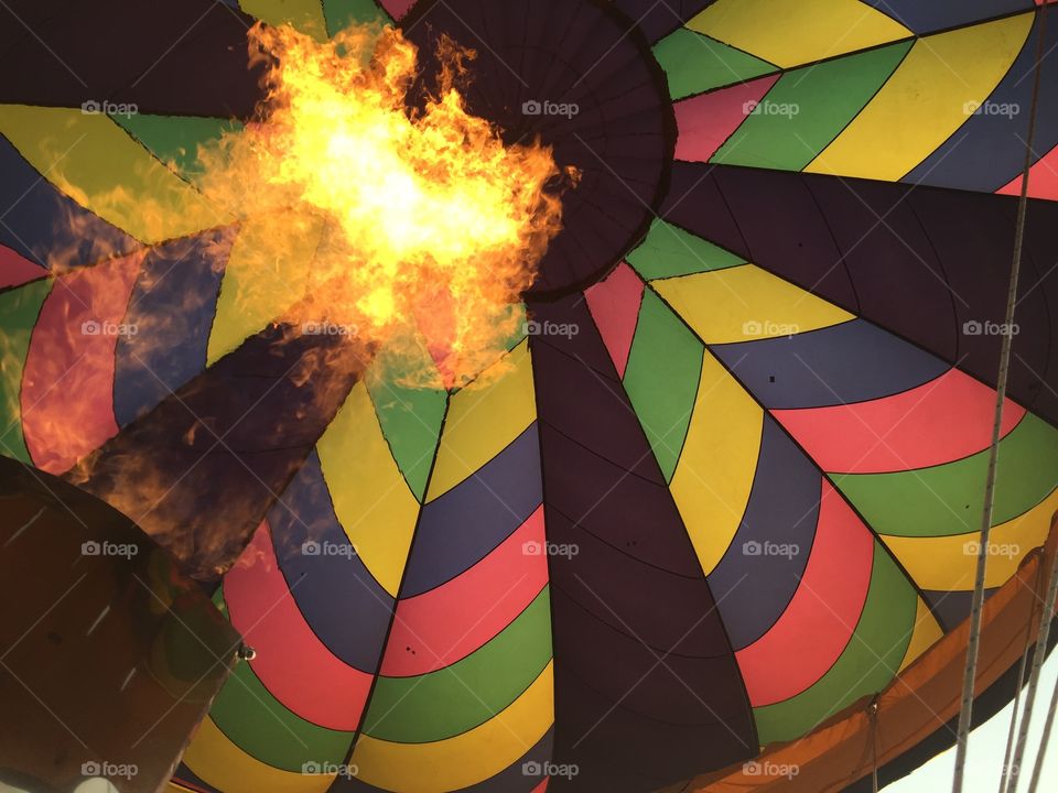 Burn for altitude. Shot of the burn of a hot air balloon from the basket. 