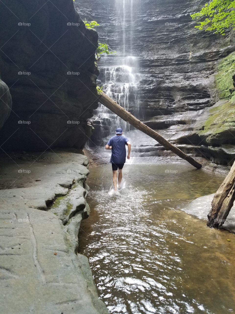 trail running in stream at waterfall