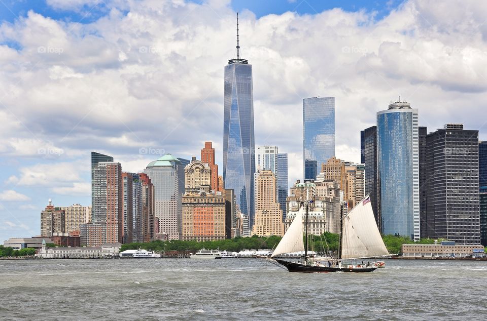 Financial District. Old sailboat in front of the newly completed Freedom Tower in Manhattan's financial district. View from Governors Island