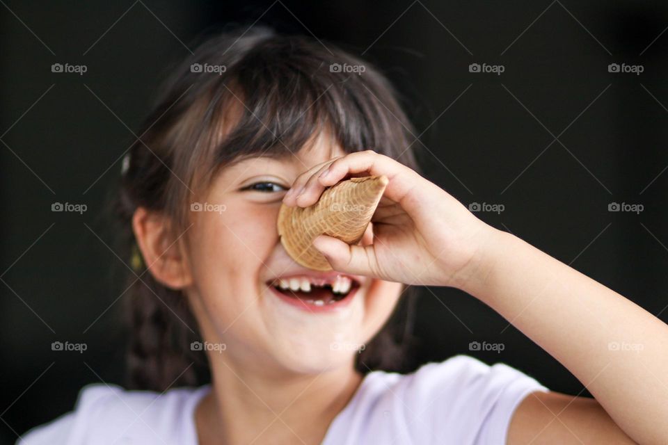 Cute happy girl with an ice cream cone