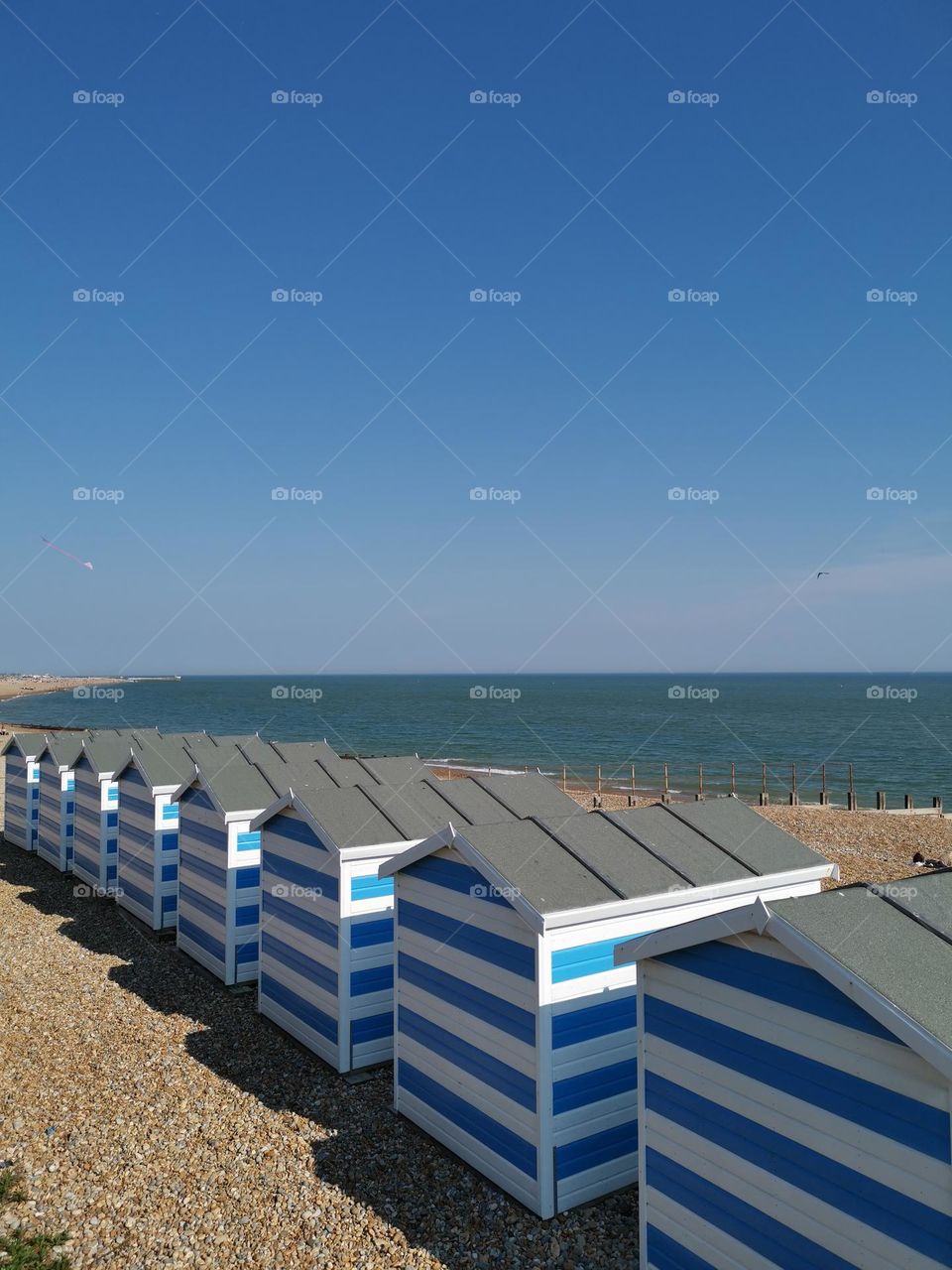 Multiple beach houses. Seashore.