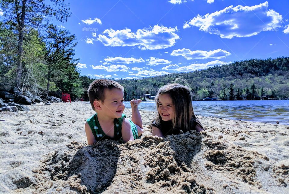 playing in the sand at the beach