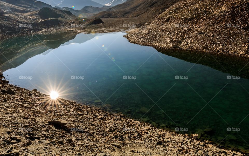 when I bought the sun down to the earth I deserve to win this mission 🙂🥰 just kidding. Reflection of gorgeous sunstar on the crystal clear lake water