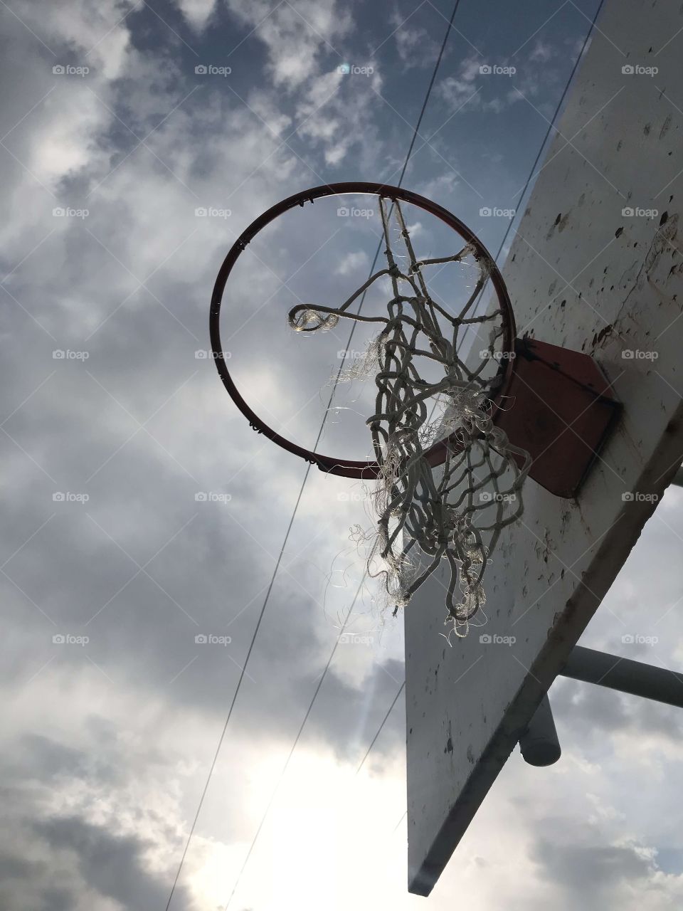 An old basketball hoop being used for something good