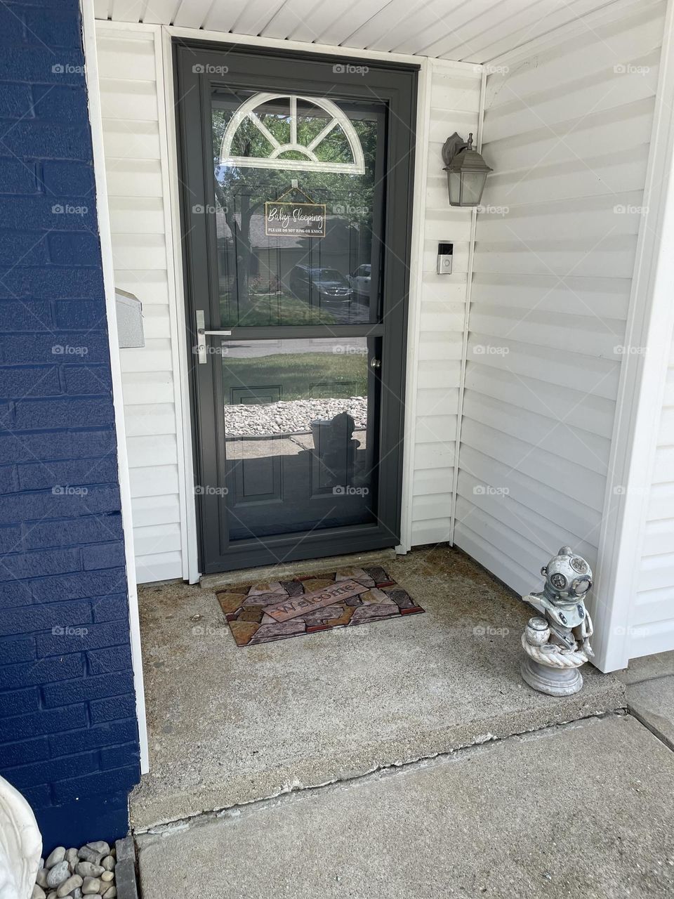 Entryway to home, coming home, front entrance to house, ring doorbell, statues as decor 