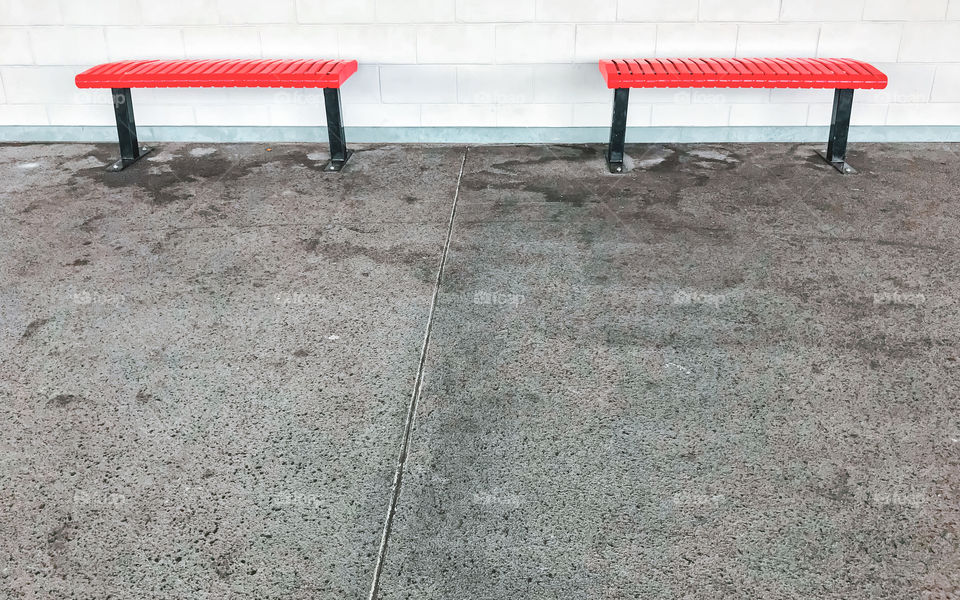 Singapore, something simple and modest, minimalism, capturing the two empty red bench with white wall background
