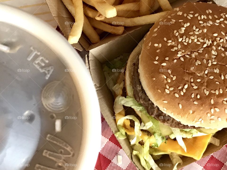 McDonald’s Big Mac, fries and drink on a red a white checkered background 