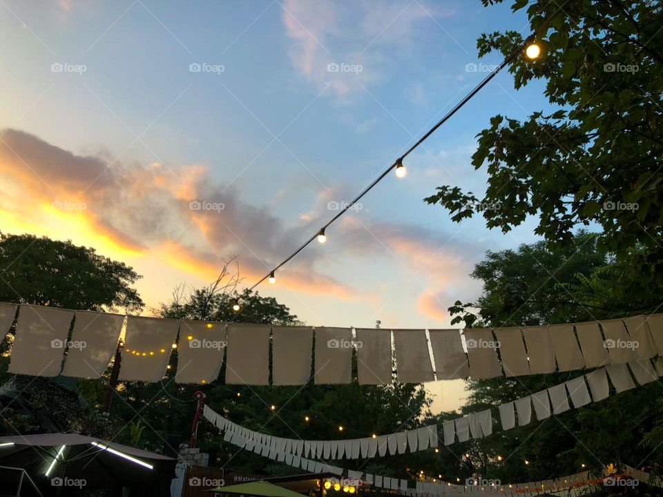 Sunset with flags and garlands in park in Odesa 