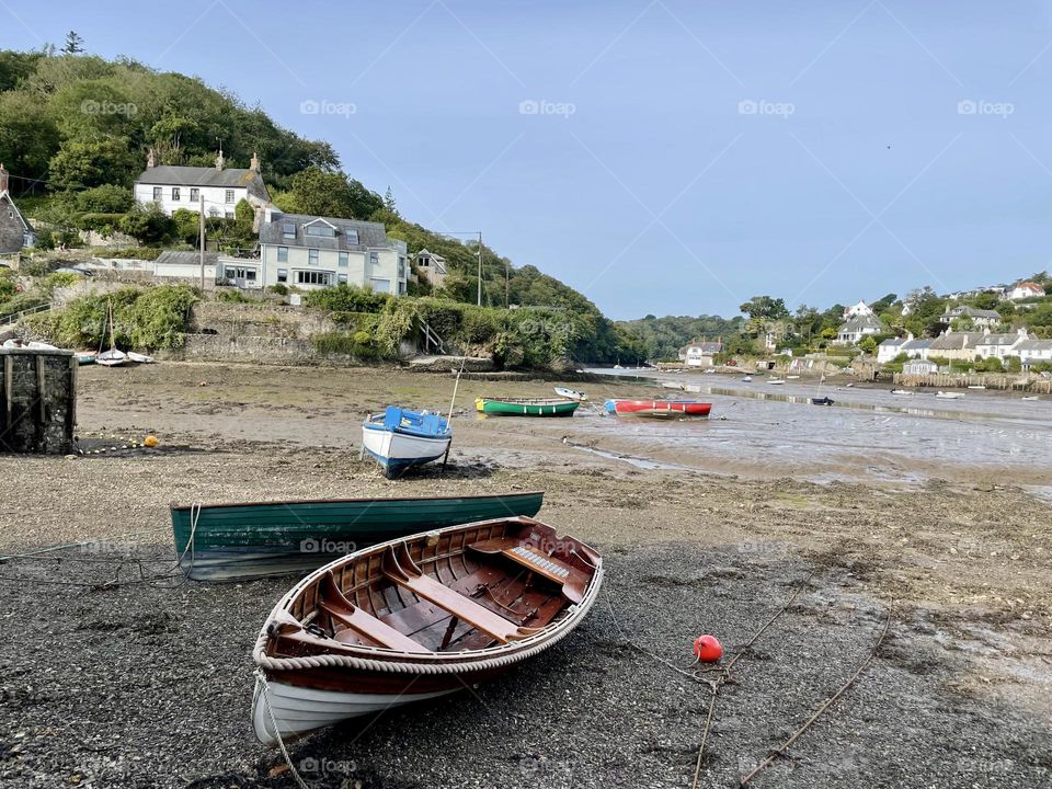 Little boats stranded at low tide 