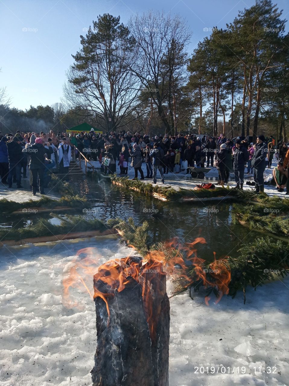 Epiphany. People swim in the ice-hole for Epiphany. Fire.