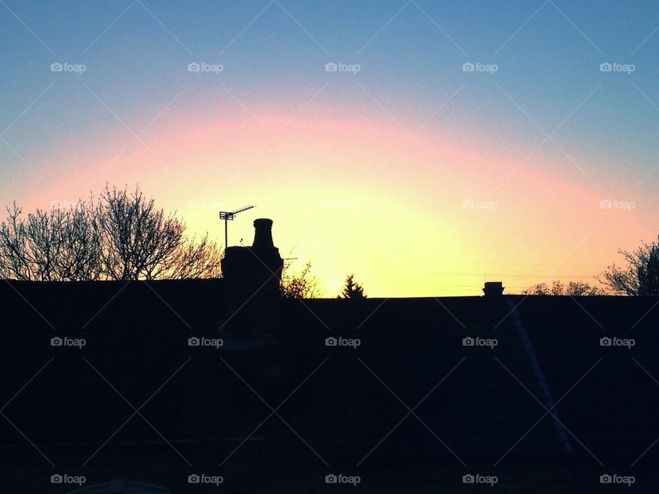 Sunset over houses