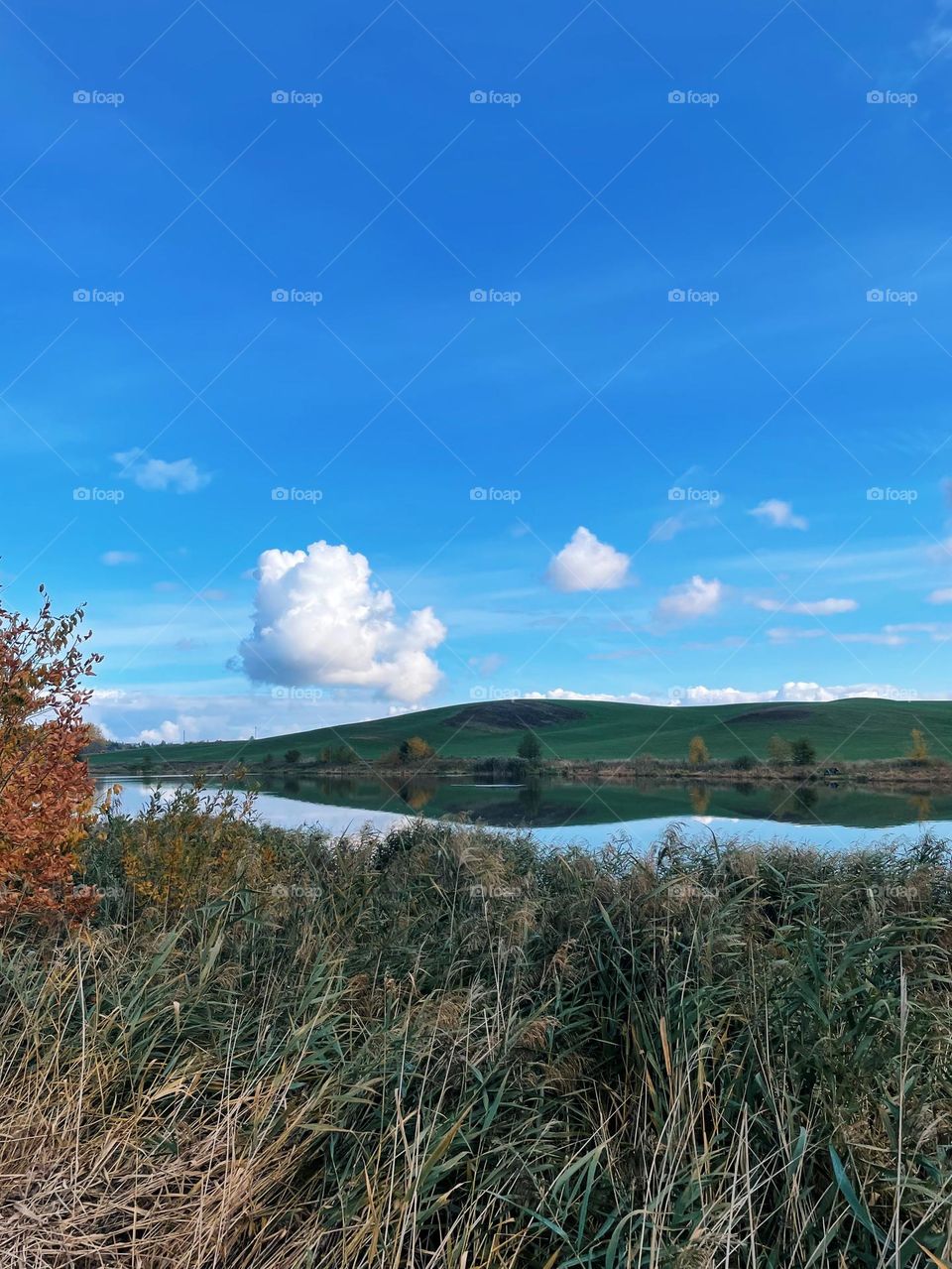 Beautiful autumn landscape with reflections in the river