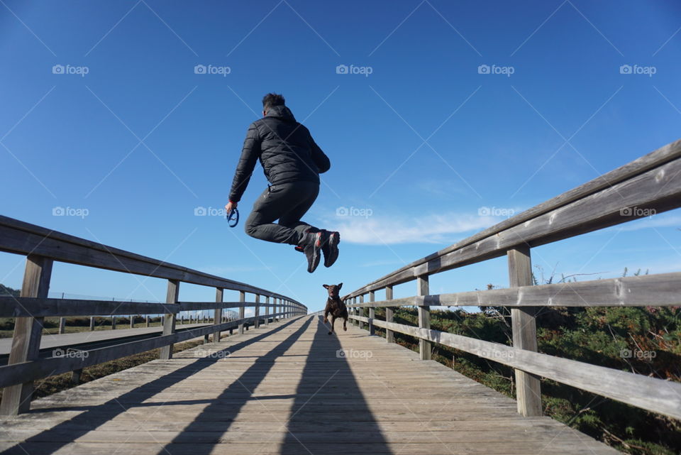 Jump#walk#sky#human#dog#nature