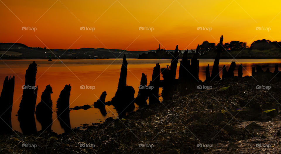 After sunset, the sky takes on fantastic colors. Here we have a warm and Deep dark Orange bronze.