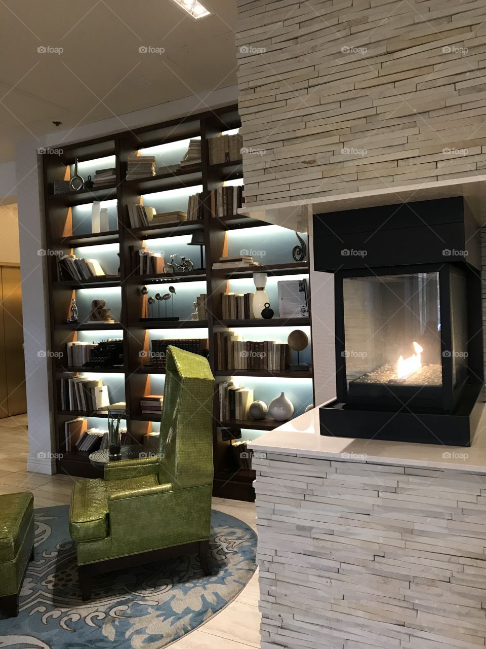 Retro bookcase chair and fireplace 