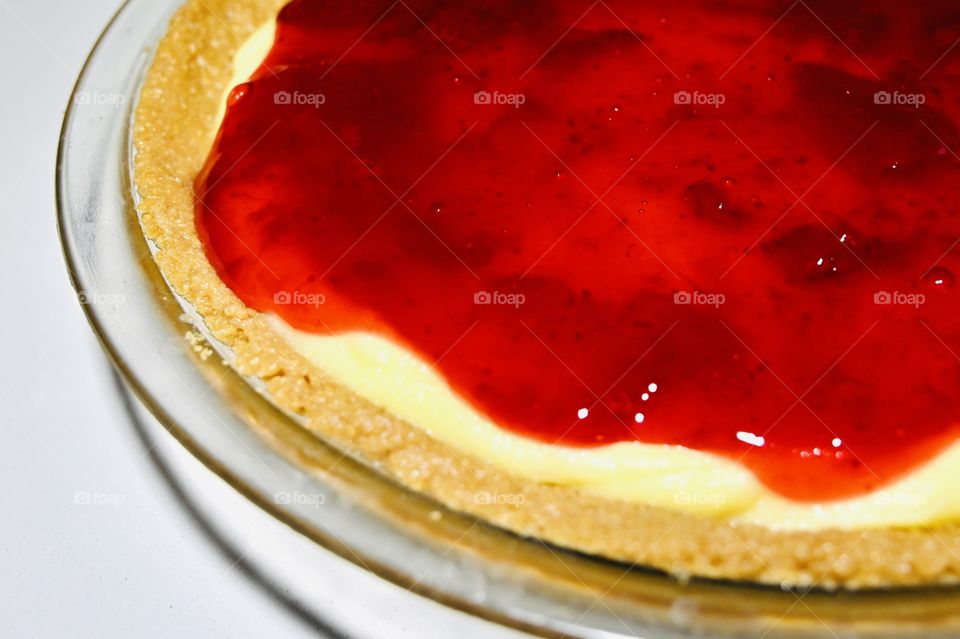 The freshly homemade strawberry cheesecake at home. 