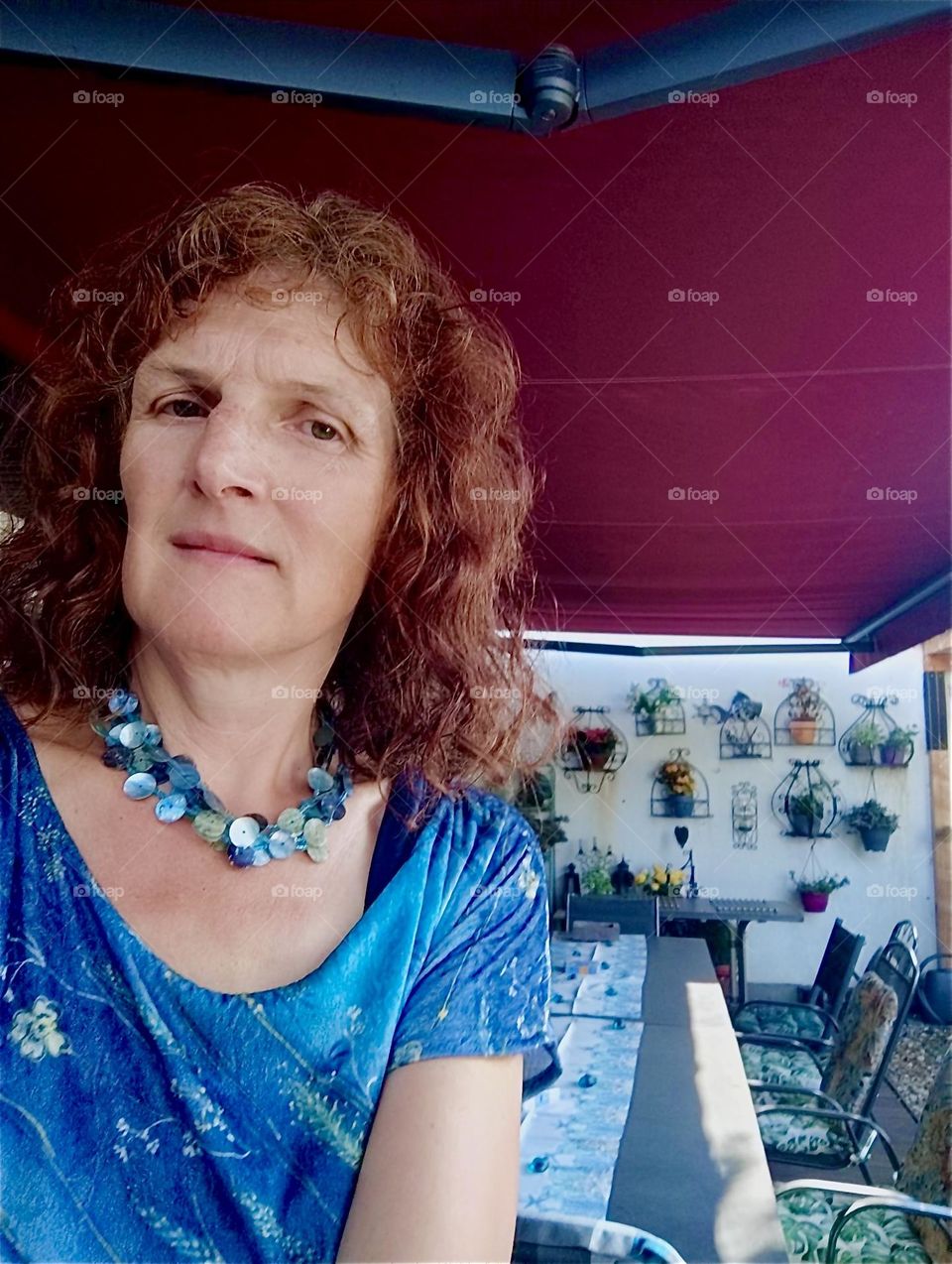 Today is the beautiful lady’s birthday and she is celebrating it on the veranda of her house in “Straubing”, “Lower Bavaria” waiting for the guests to arrive. 2024. Hypnotic Productions