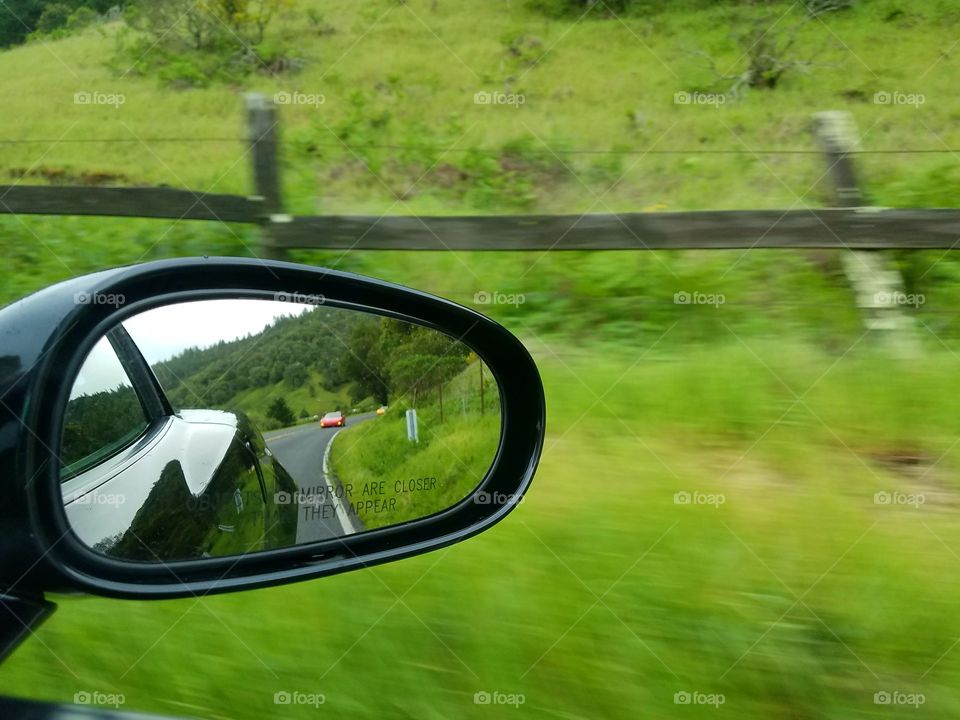 driving car green grass road