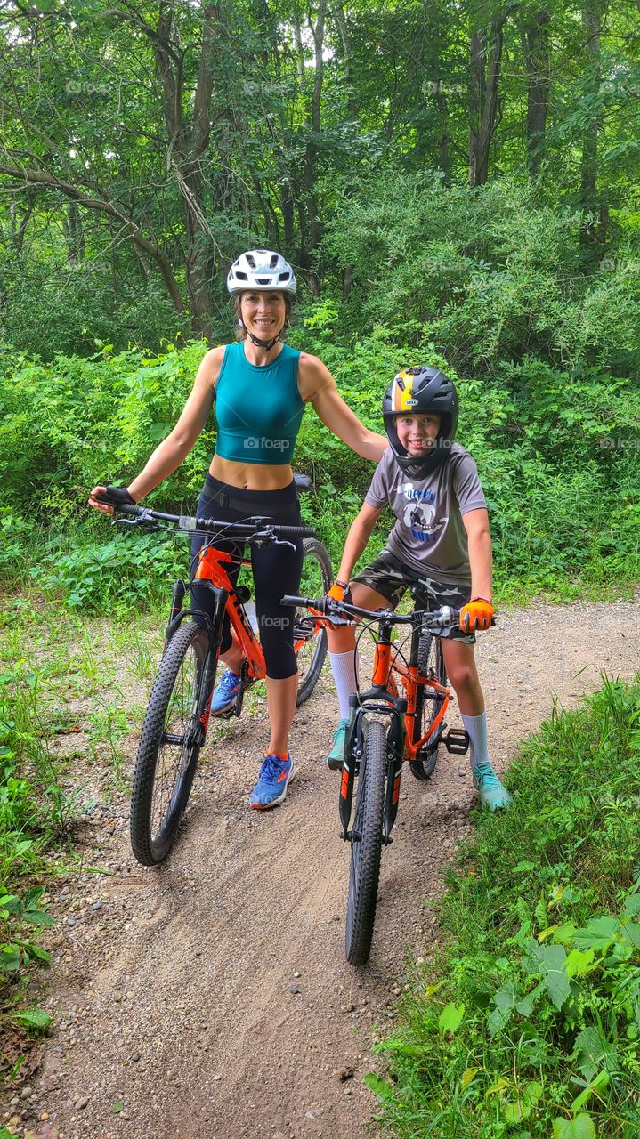 mother and son mountain biking