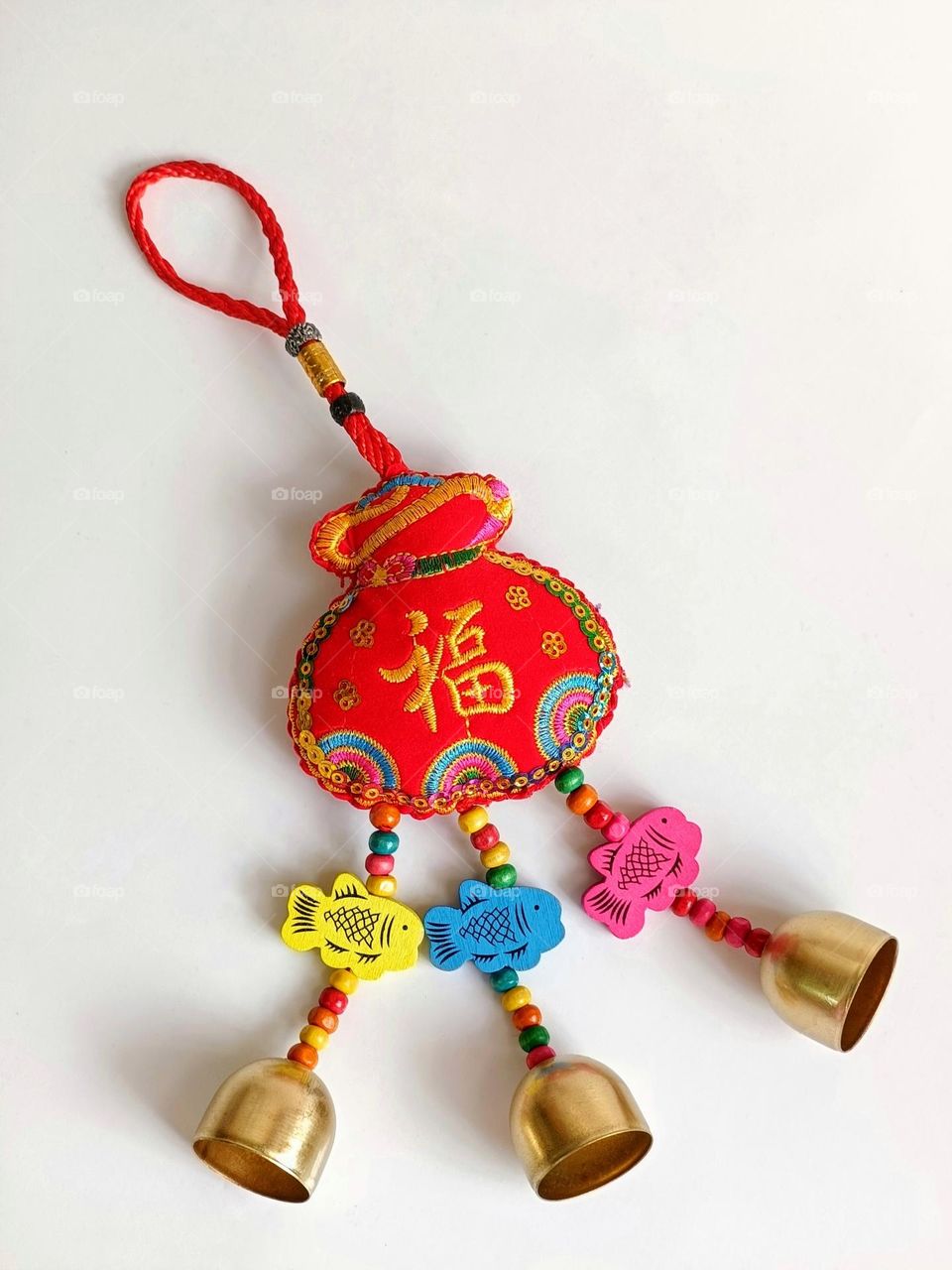A Chinese New Year hanging decoration with the prosperity Chinese word on white background.