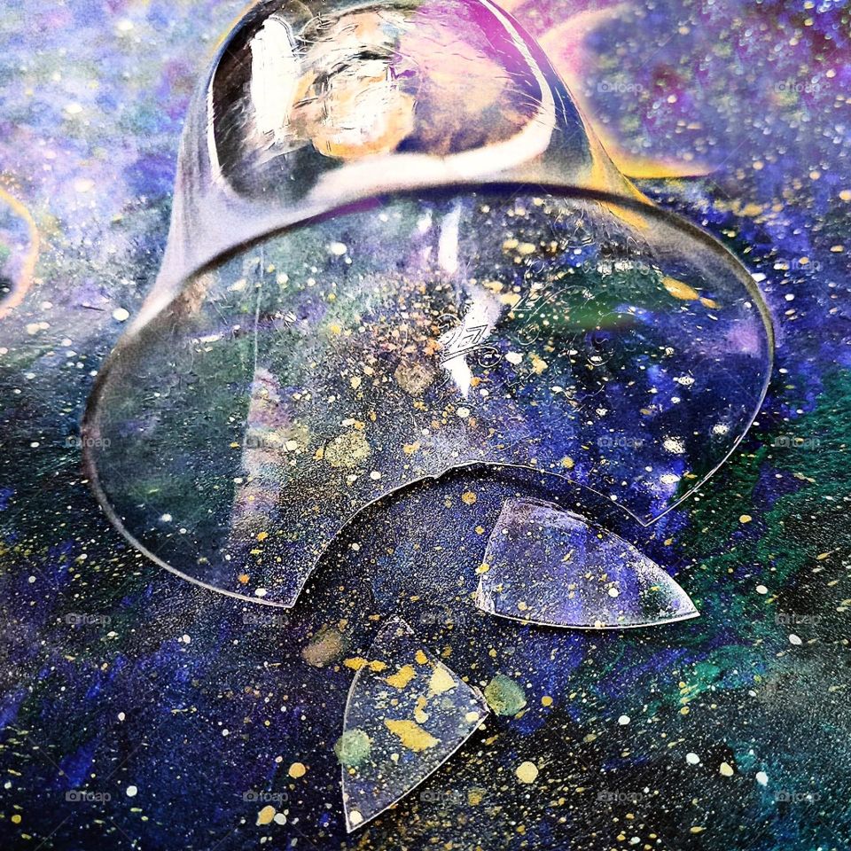 Something broken but still beautiful. Broken glass on the space painting