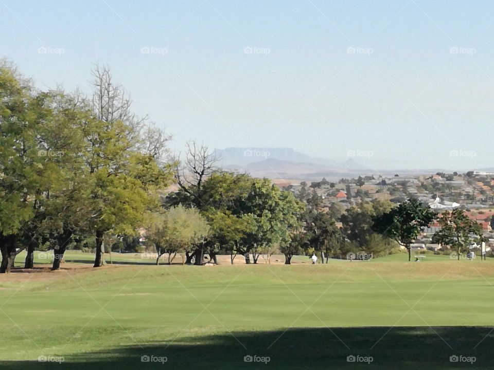 Malmesbury golf club 18th hole. table mountain 60km far in background