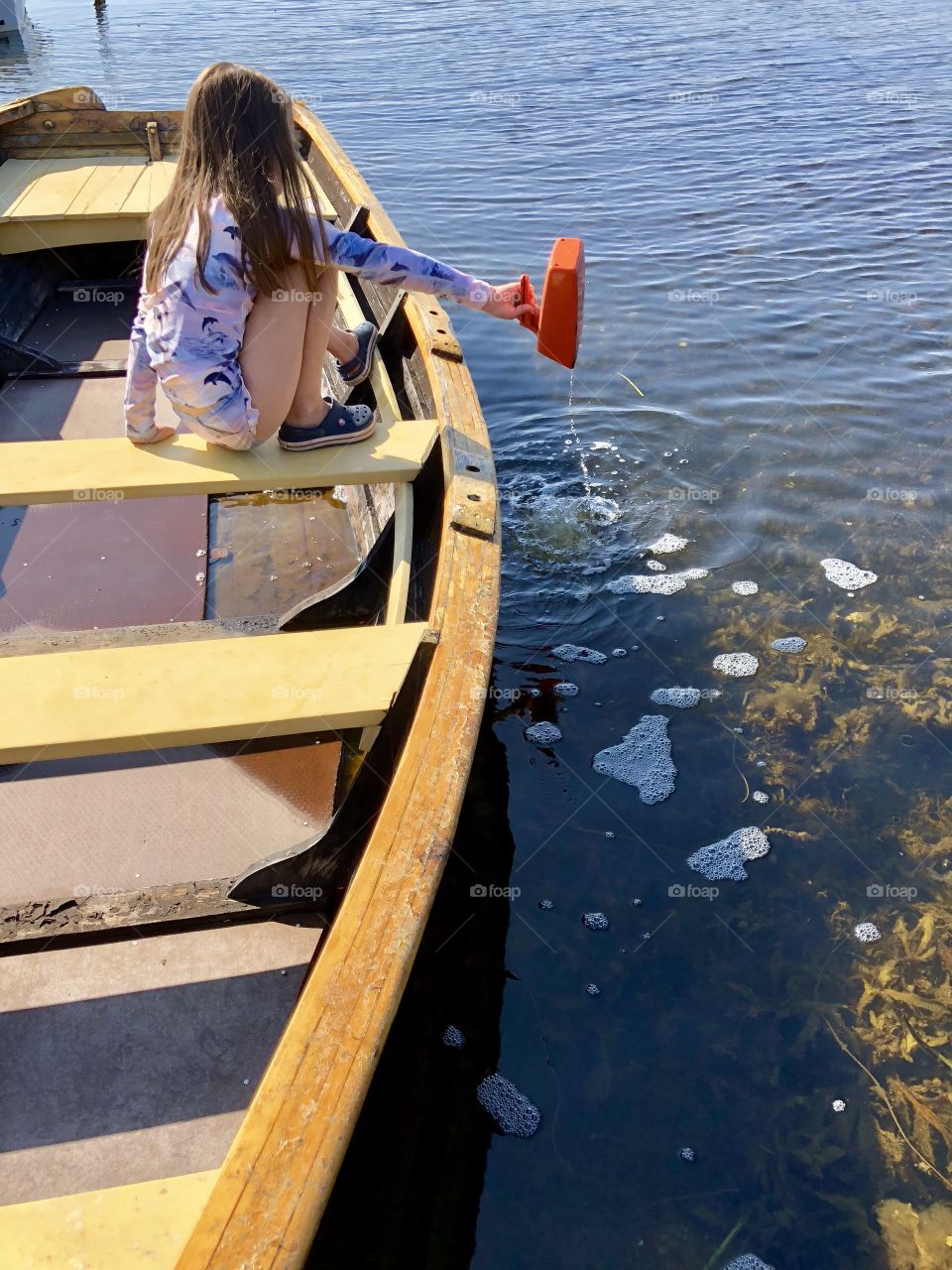 pouring water from the boat