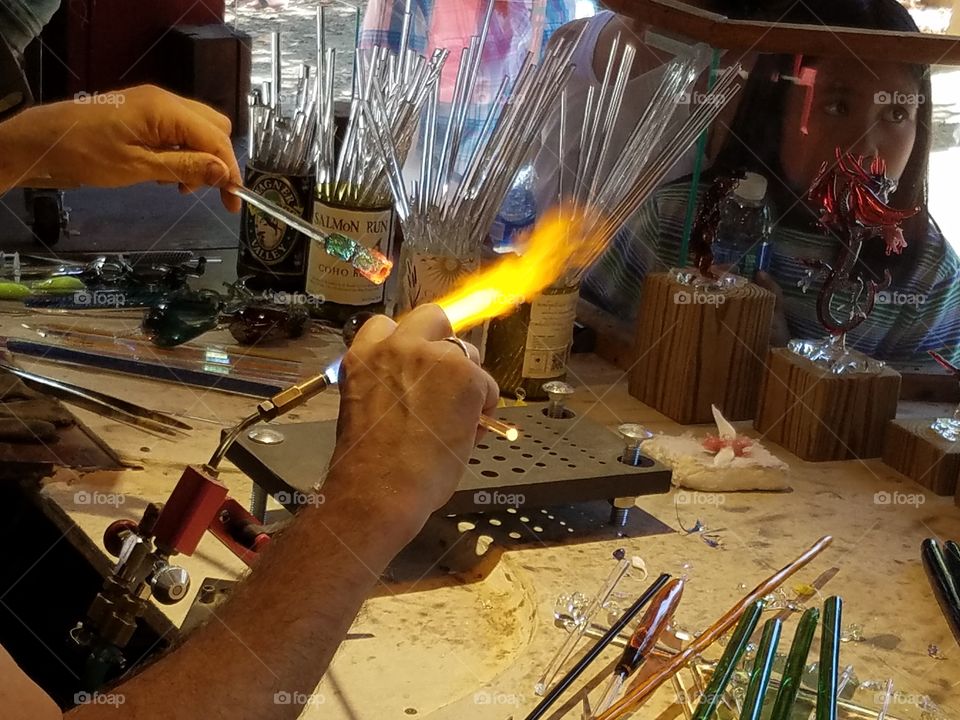 Fire forming glass