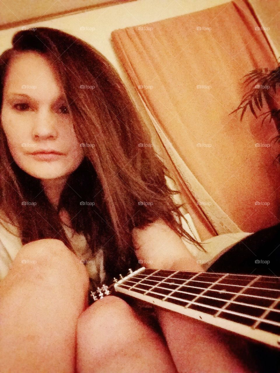 Close-up of a woman with guitar