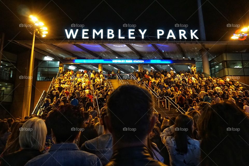 Love this photo ... happy times (before Covid) walking back to catch the tube from a wonderful concert ... love how the street light, lights up the crowd 